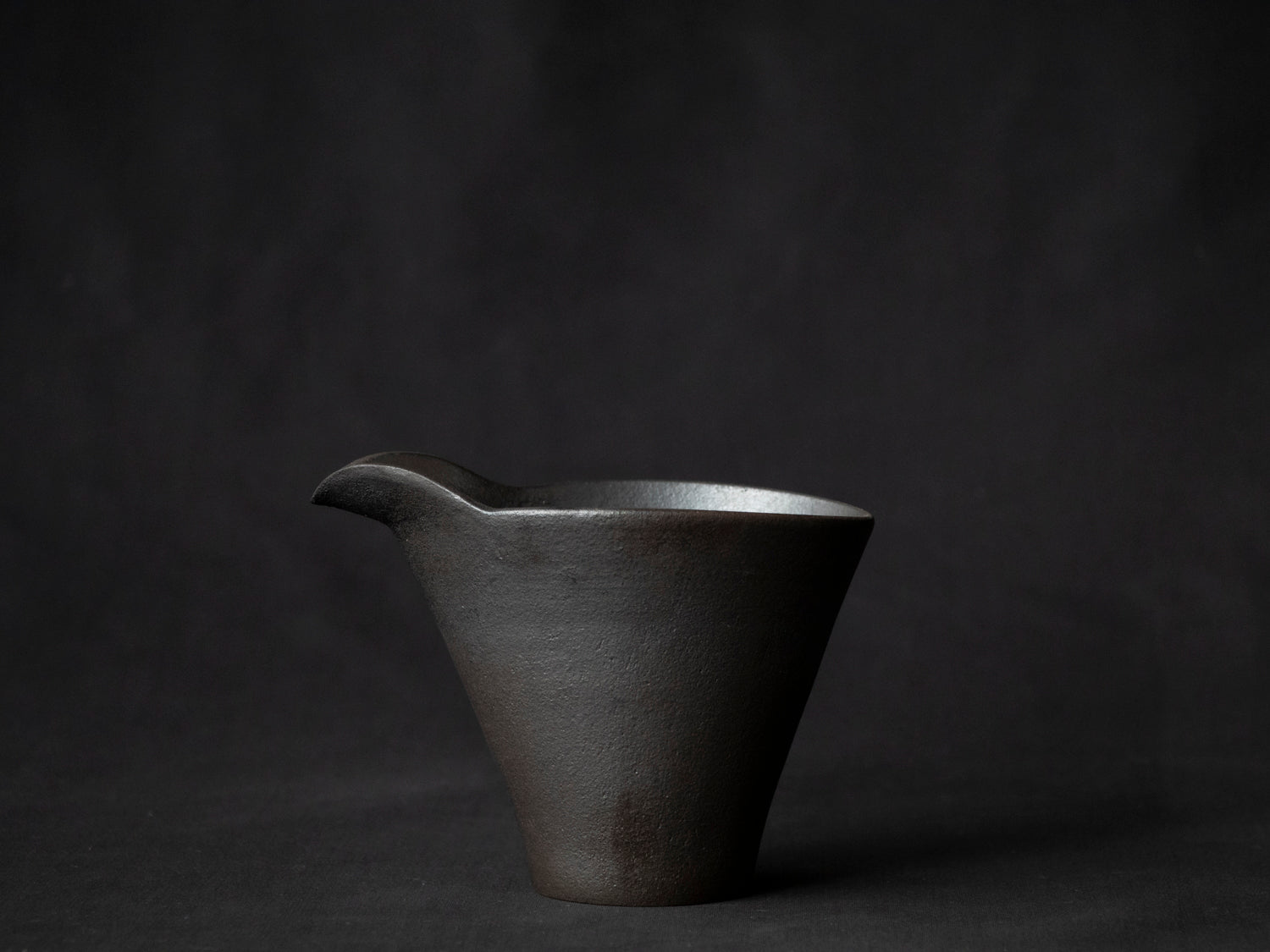 side view of black ceramic carafe